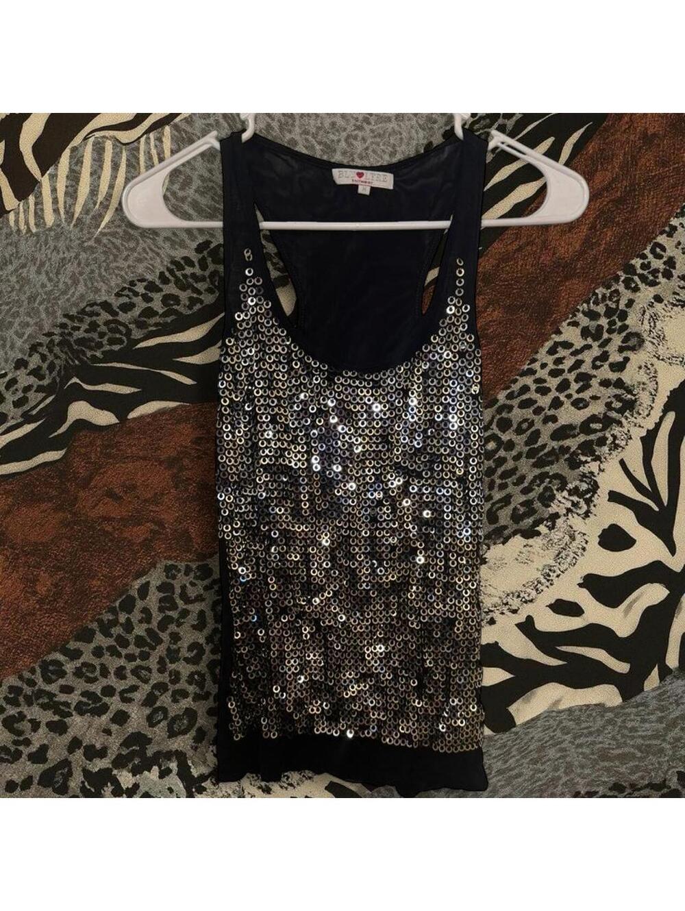 Black top with silver sequins and sheer back.